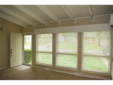 New front door and living room with lots of light.
