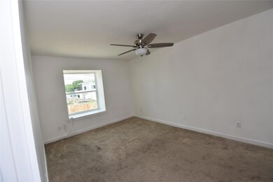 Empty room featuring carpet floors, ceiling fan, 