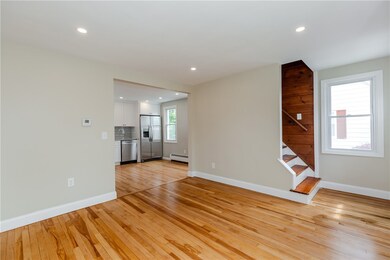 Living room with stair going to upper level bedroo