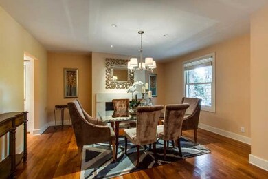 Lovely dining room. Wood burning fireplace presently using gas logs