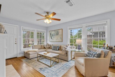 Living room featuring wood-type flooring, ceiling