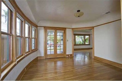 French doors allow direct access to front porch from dining.