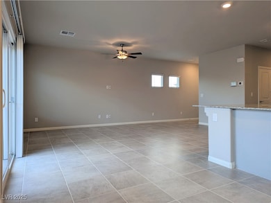 Spare room with light tile patterned floors, a cei