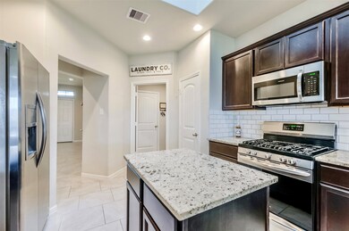 Island perfect for dinner preparation and plenty of countertop space