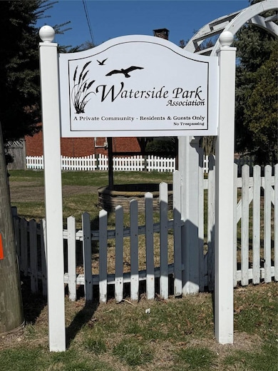 Community sign with fence