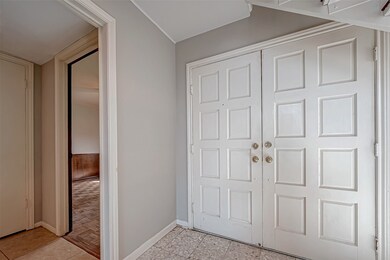 This entryway features double doors with a paneled