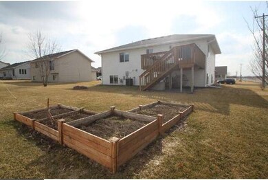Back of home with large lot and nice deck off dini