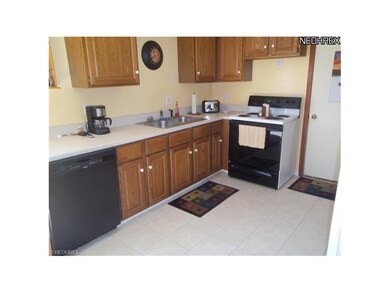 Good sized Kitchen with plenty of cabinets and ceramic floor