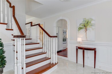 Gracious staircase in foyer - Brazilian cherry flo
