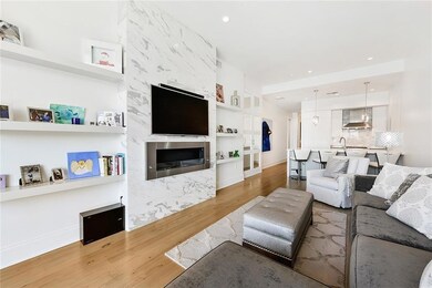Living Room: Antique pine floors, marble fireplace