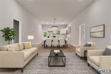 Living area featuring recessed lighting and light wood finished floors