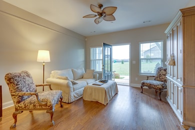 A spacious open living and dining area with lots of natural light welcomes you! The primary suite is to the right