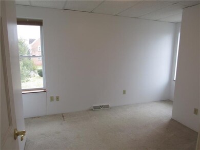 bedroom #2 white walls, neutral carperting