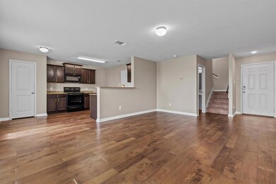 Unfurnished living room with baseboards, visible 