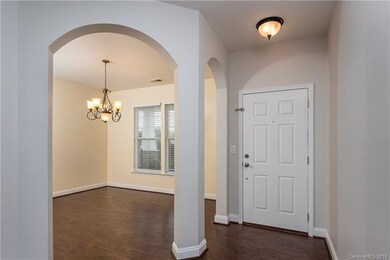 Front entry and dining room defined by beautiful a