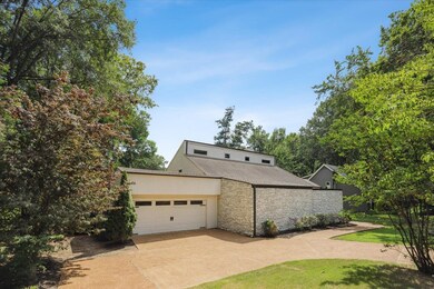 View of side of home with a garage