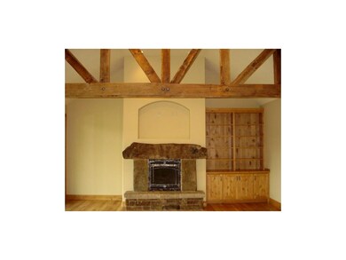 Great room features 100 yr. old barn beams, Arkans