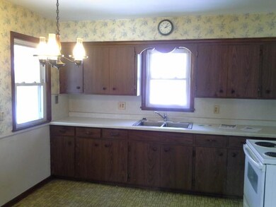 Eat in kitchen walks out to garage area.
