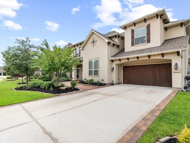 Side view of Beautiful stucco home with dark  wood