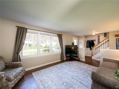Formal living room photo looking out to front yard