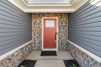 Property entrance featuring stone siding