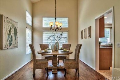 The formal dining room. A dramatic arch separates 