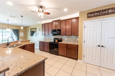 Open kitchen showcasing granite countertops, plent
