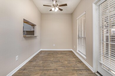 Empty room with ceiling fan, dark hardwood / wood-