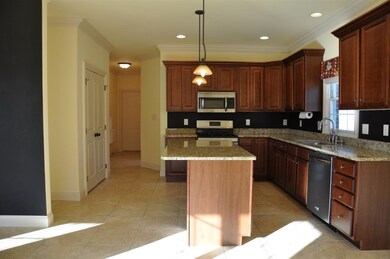 This kitchen features beautiful custom cabinets.