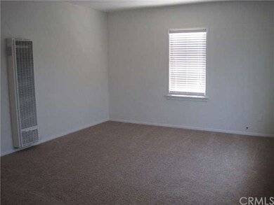 Living room with new paint, carpet, and blinds