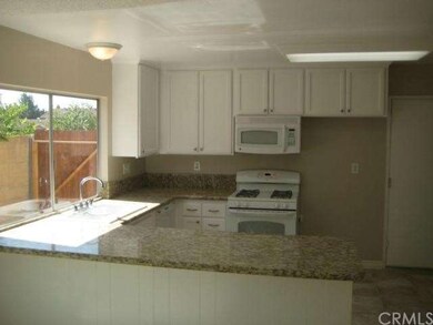 open kitchen with builtin breakfast bar