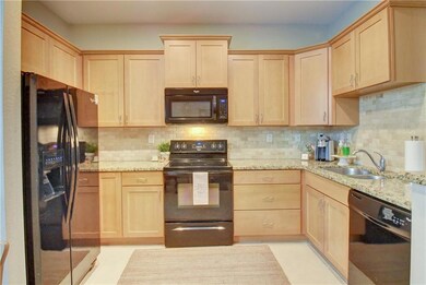 Spacious kitchen with granite counter top & all ki