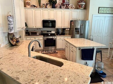 Kitchen with appliances with stainless steel finis