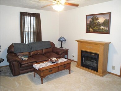 Living room complete with ceiling fan. Newer wall 