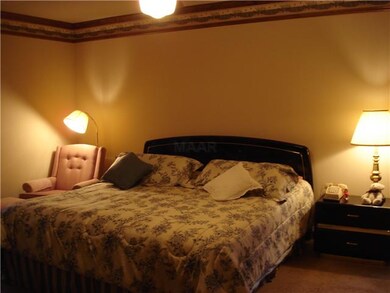 The master bedroom is extremely large with a salon