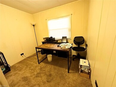 Office space featuring light carpet
