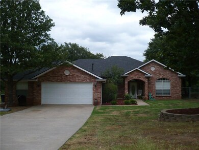 Front with concrete drive and great landscaping!