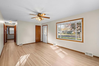 Newly refinished hardwood floors and large bay window make this living room light and bright.
