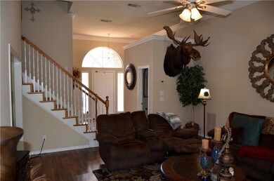 Open living room has high ceilings, fireplace with