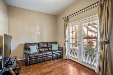 Office area to the right of entry with French doors leading to front porch