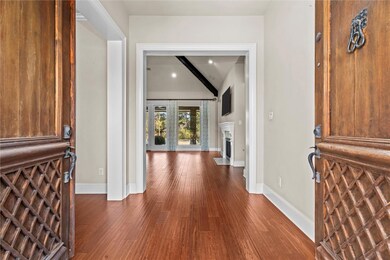 Entrance foyer featuring beam ceiling, wood-type f