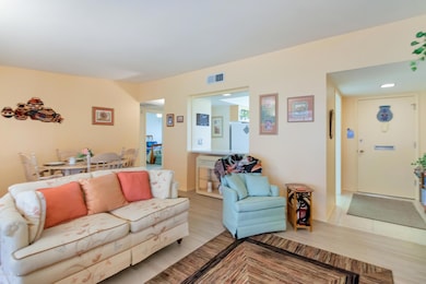 great room has newer wood like tile floo