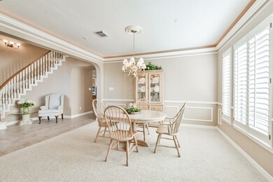 With double crown molding, uplighting, wainscoting and large picture window, it reflects a very elegant aesthetic