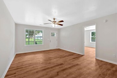 Front room view from breakfast room and door to primary suite