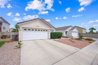 Single story home with concrete driveway, fence, c