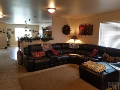 LIVING ROOM VIEW TO FRONT DOOR