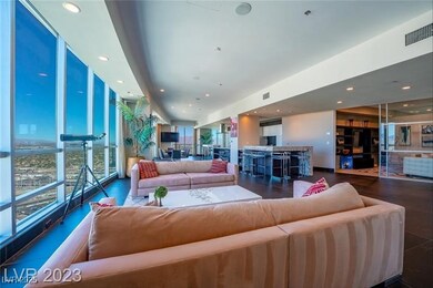 Living area with recessed lighting and floor to ce