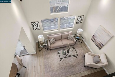 View from 2nd floor landing into living room - check out the wonderful natural light!