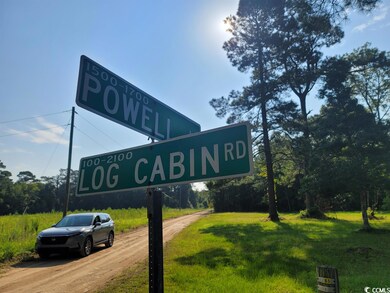 Corner Log Cabin and Powell Ln
