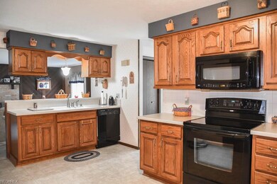 The kitchen offers Corian countertops and a sink o